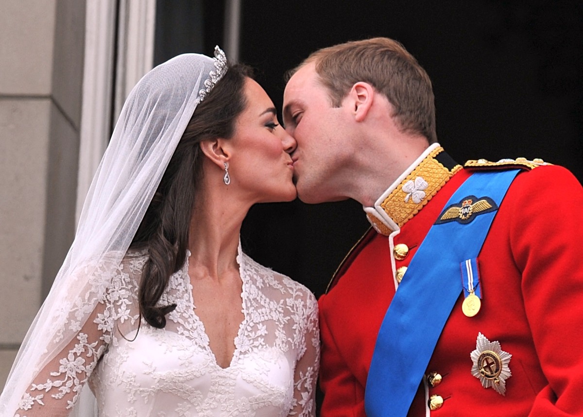(FILES) Prince William and his wife Kate Middleton, Duchess of Cambridge, kiss on the balcony of Buckingham Palace in London, following their wedding on April 29, 2011. Prince William and wife Catherine will celebrate their 14th wedding anniversary on the Scottish island of Mull on April 29, 2025, the latest step on the princess's road to recovery from cancer. Catherine, Princess of Wales, revealed in January that she was "in remission" having announced last March she had been diagnosed with an unspecified form of the disease and was undergoing chemotherapy. (Photo by JOHN STILLWELL / POOL / AFP)